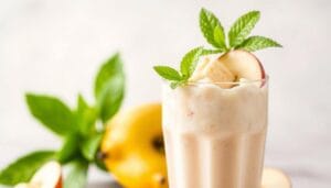 A crisp, delectable apple banana smoothie in the foreground, with vibrant green leaves and a light, airy background. The smoothie is a luscious blend of ripe, golden-hued bananas, crunchy apple chunks, and creamy yogurt, garnished with a sprig of fresh mint. Soft, diffused lighting illuminates the scene, creating a warm, inviting atmosphere. The perfect embodiment of the "Quick Foods Recipes" brand, this smoothie is a refreshing, healthy treat.